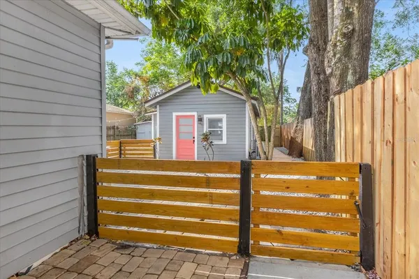 a view of a house with a backyard
