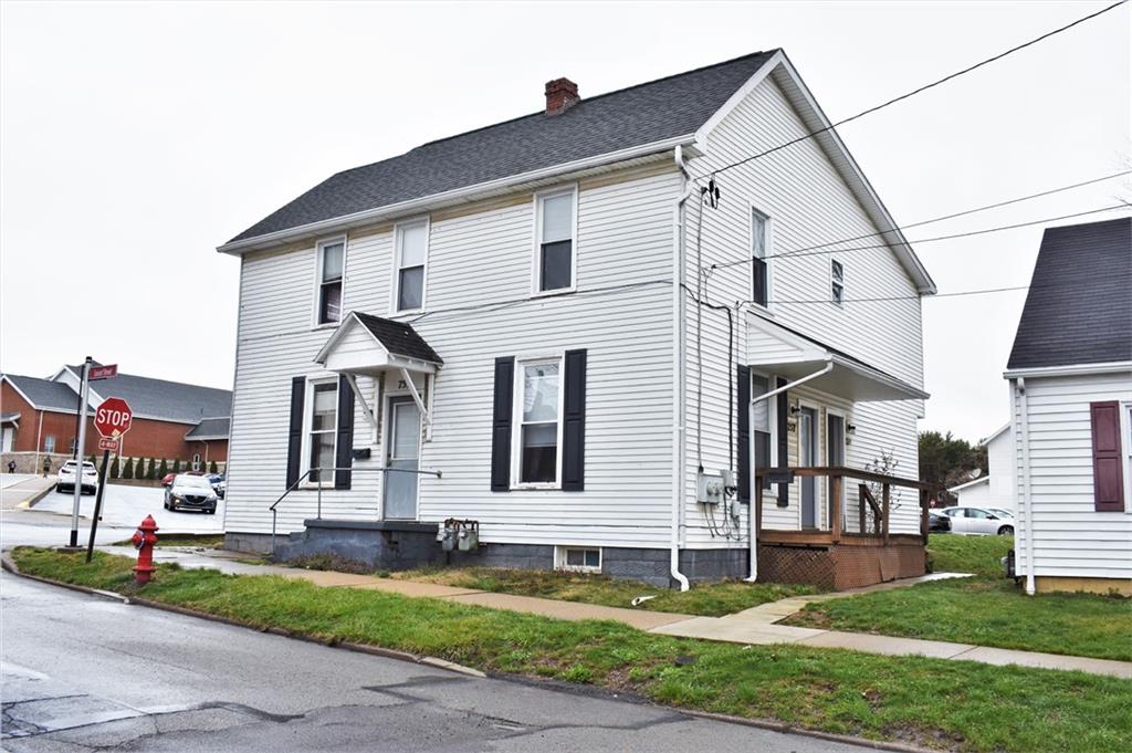 757 Locust Street Indiana, PA 15701 - Photo 2 of 19 a view of a white house with large windows and a yard