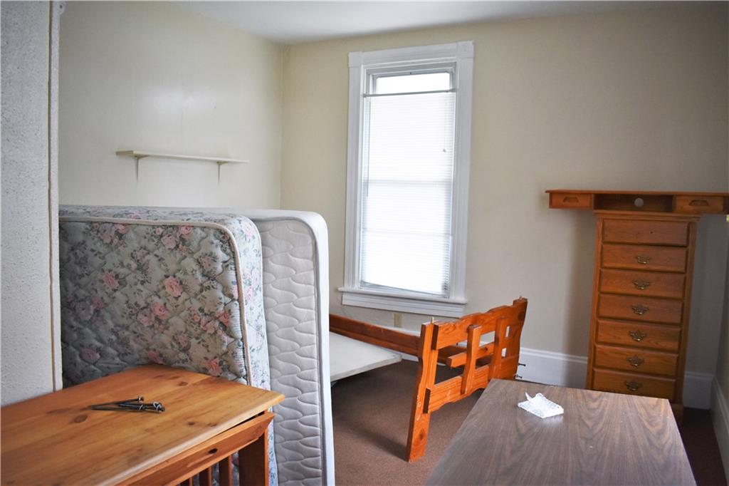 757 Locust Street Indiana, PA 15701 - Photo 8 of 19 a bedroom with a bed and a window