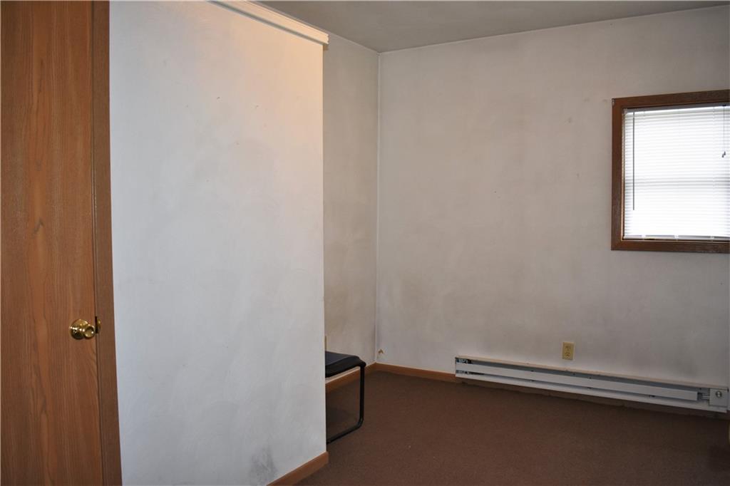 757 Locust Street Indiana, PA 15701 - Photo 9 of 19 a room with a bench and a window