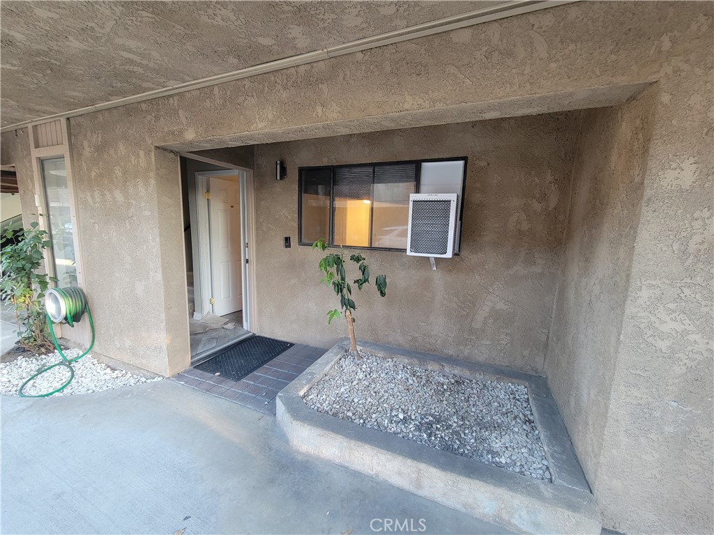 15005 Indiana Paramount, CA 90723 - Photo 1 of 7 a view of a hallway to a livingroom with the potted plant
