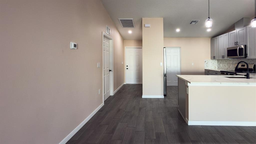 11154 Pendleton Avenue Englewood, FL 34224 - Photo 14 of 32 a view of a kitchen with a sink and a refrigerator