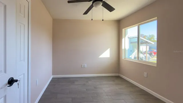 a view of an empty room with a window