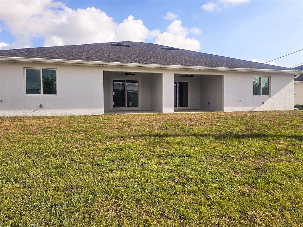 11154 Pendleton Avenue Englewood, FL 34224 - Photo 17 of 32 a front view of a house with a garden