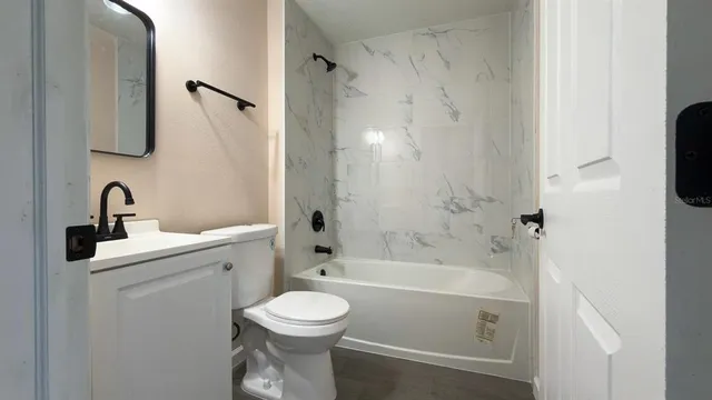 a bathroom with a sink toilet and a bathtub
