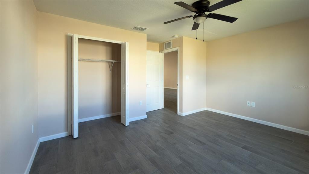 11154 Pendleton Avenue Englewood, FL 34224 - Photo 26 of 32 wooden floor in an empty room