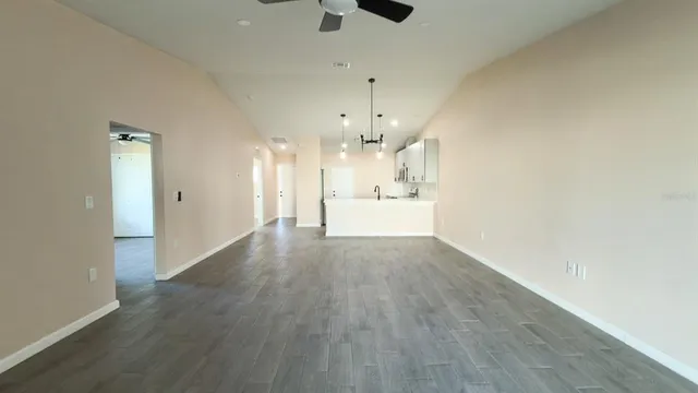 a kitchen with white cabinets stainless steel appliances and sink