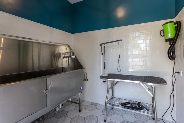 a kitchen with stainless steel appliances granite countertop a sink stove a microwave and cabinets