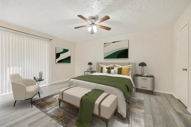 a spacious bedroom with a bed and window