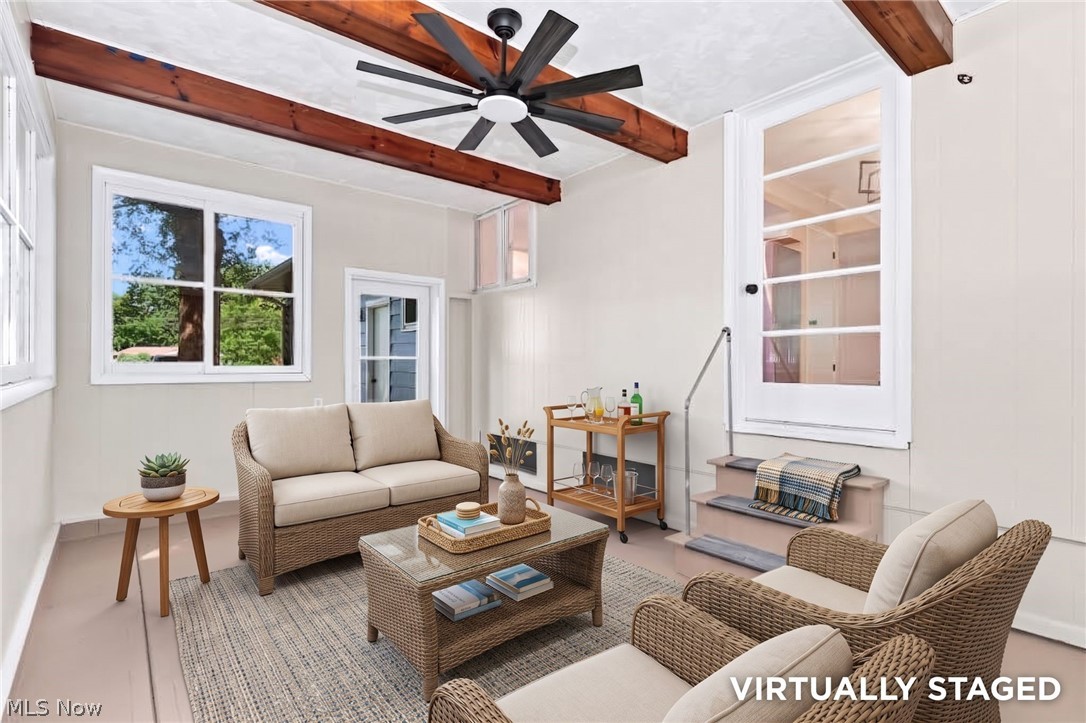 7524 Root Road North Ridgeville, OH 44039 - Photo 18 of 50 Sunroom with exposed wood ceiling beams and a multi-blade ceiling fan
