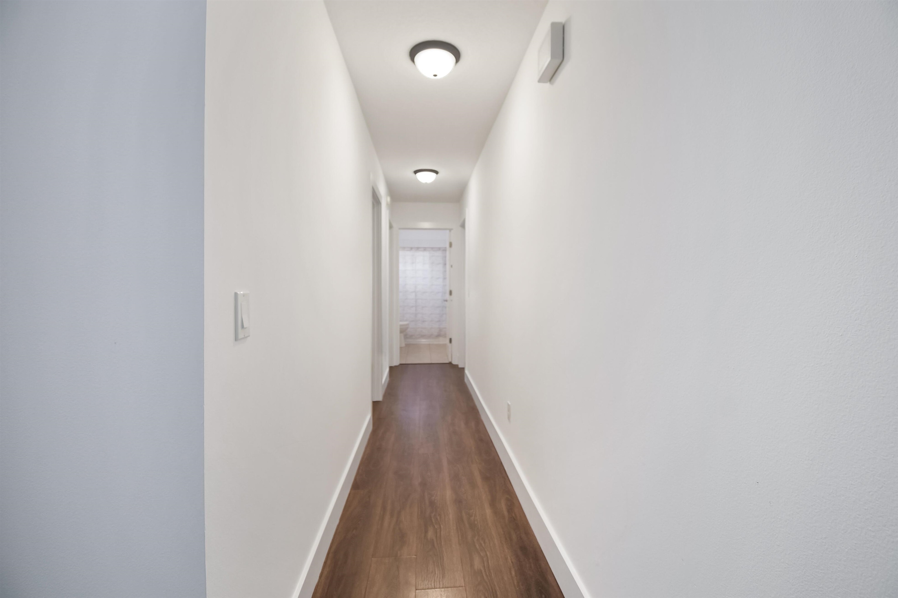 497 Pyrus Street St. Augustine, FL 32080 - Photo 10 of 36 a view of a hallway with wooden floor