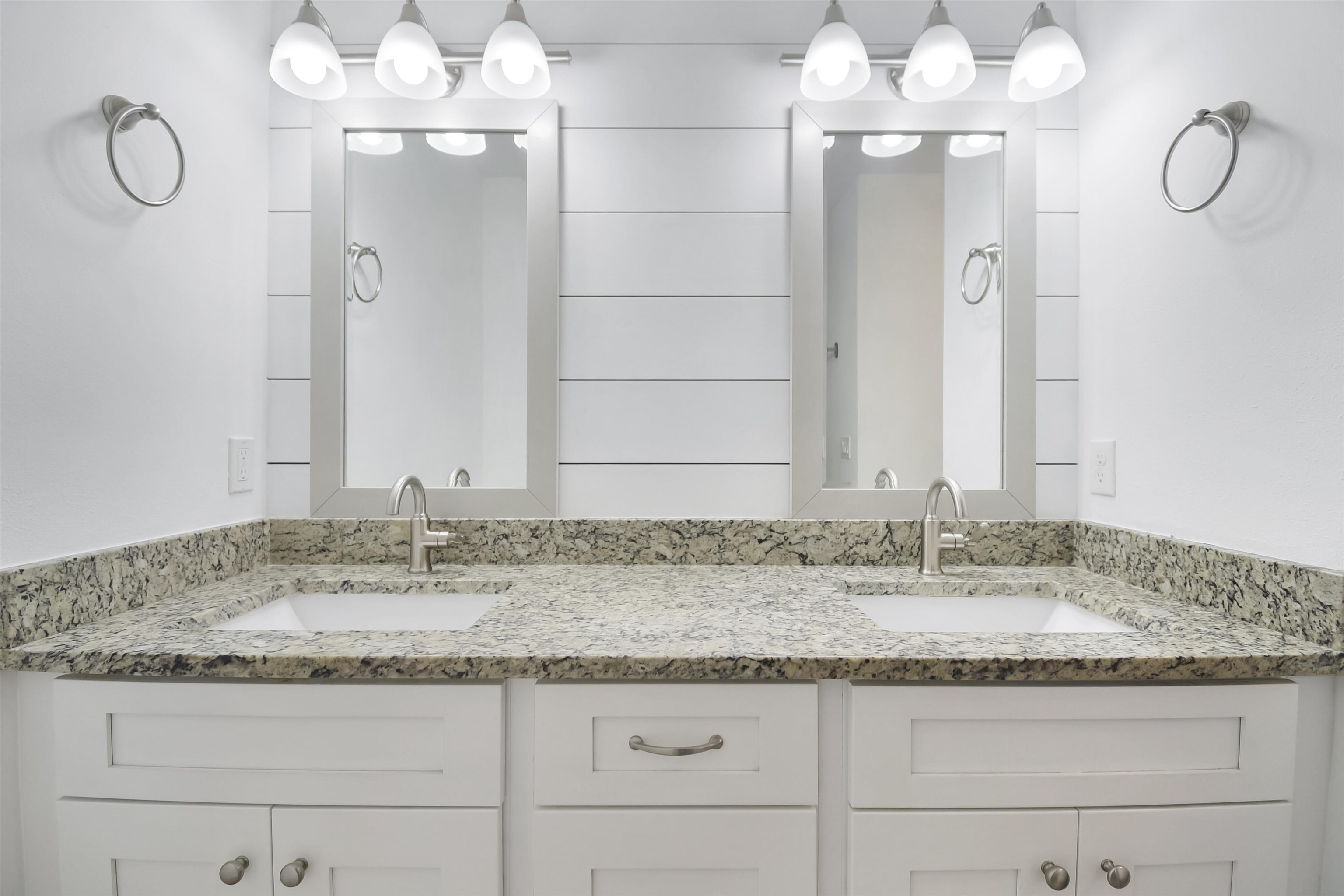 497 Pyrus Street St. Augustine, FL 32080 - Photo 16 of 36 a bathroom with a granite countertop sink and a mirror