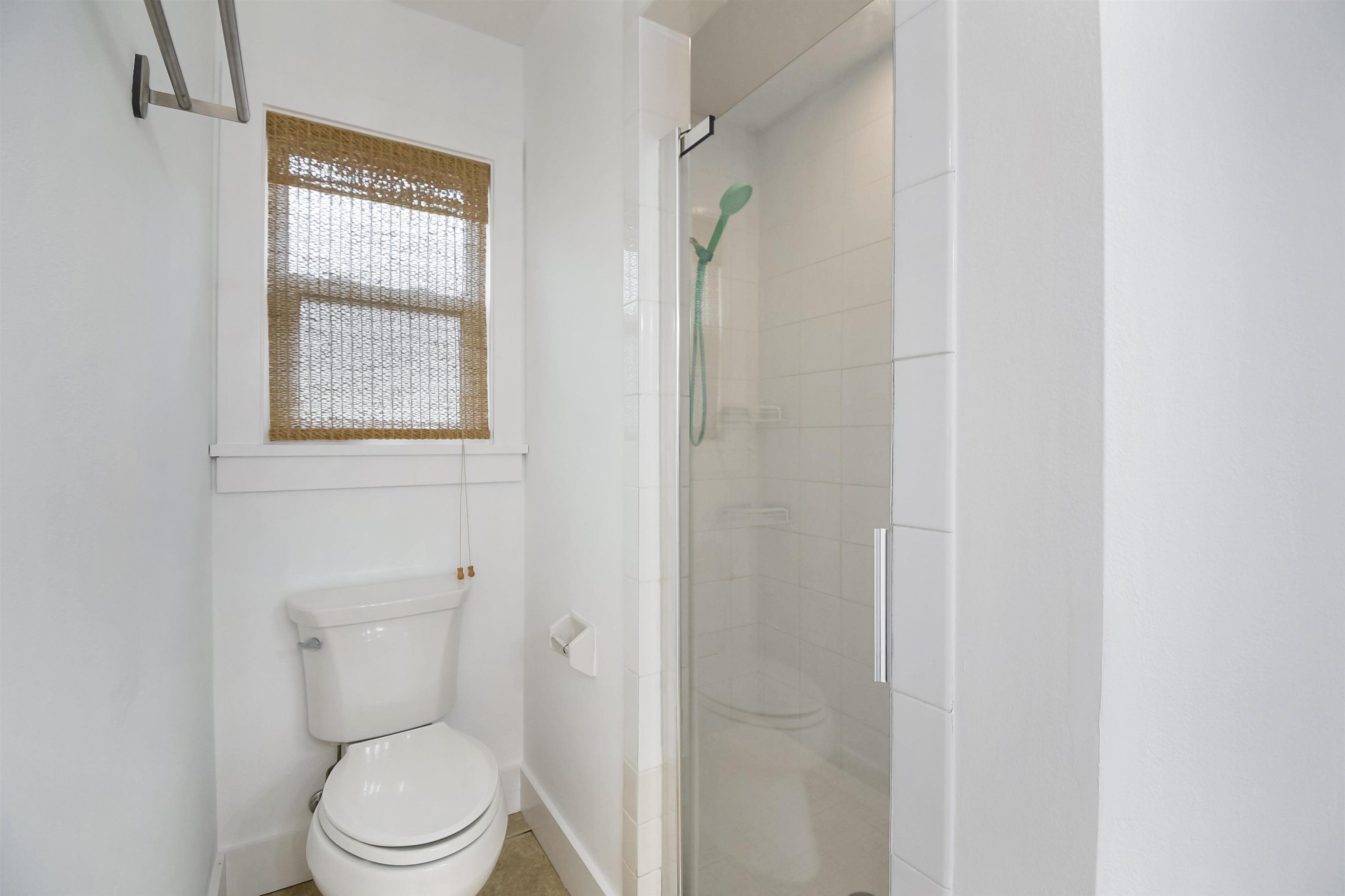 497 Pyrus Street St. Augustine, FL 32080 - Photo 17 of 36 a white toilet sitting next to a bathroom sink