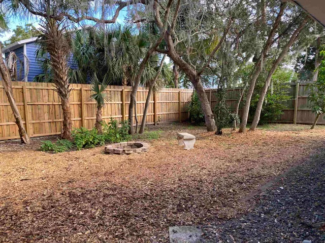 a backyard of a house with lots of green space