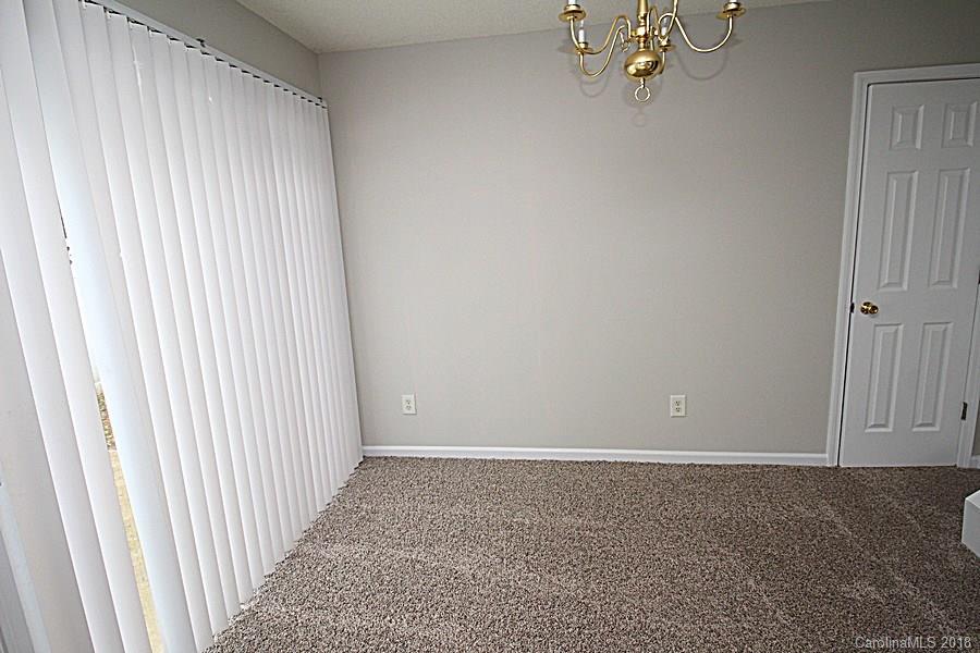 10503 Prairie Ridge Lane Charlotte, NC 28213 - Photo 6 of 9 an empty room with a window