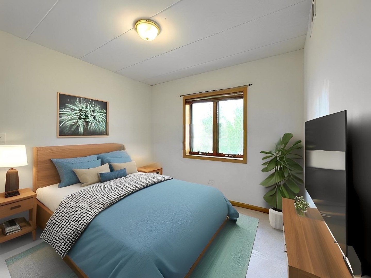 475 West 24th Street, Unit 4G Chicago, IL 60616 - Photo 13 of 20 a bedroom with a bed and a potted plant