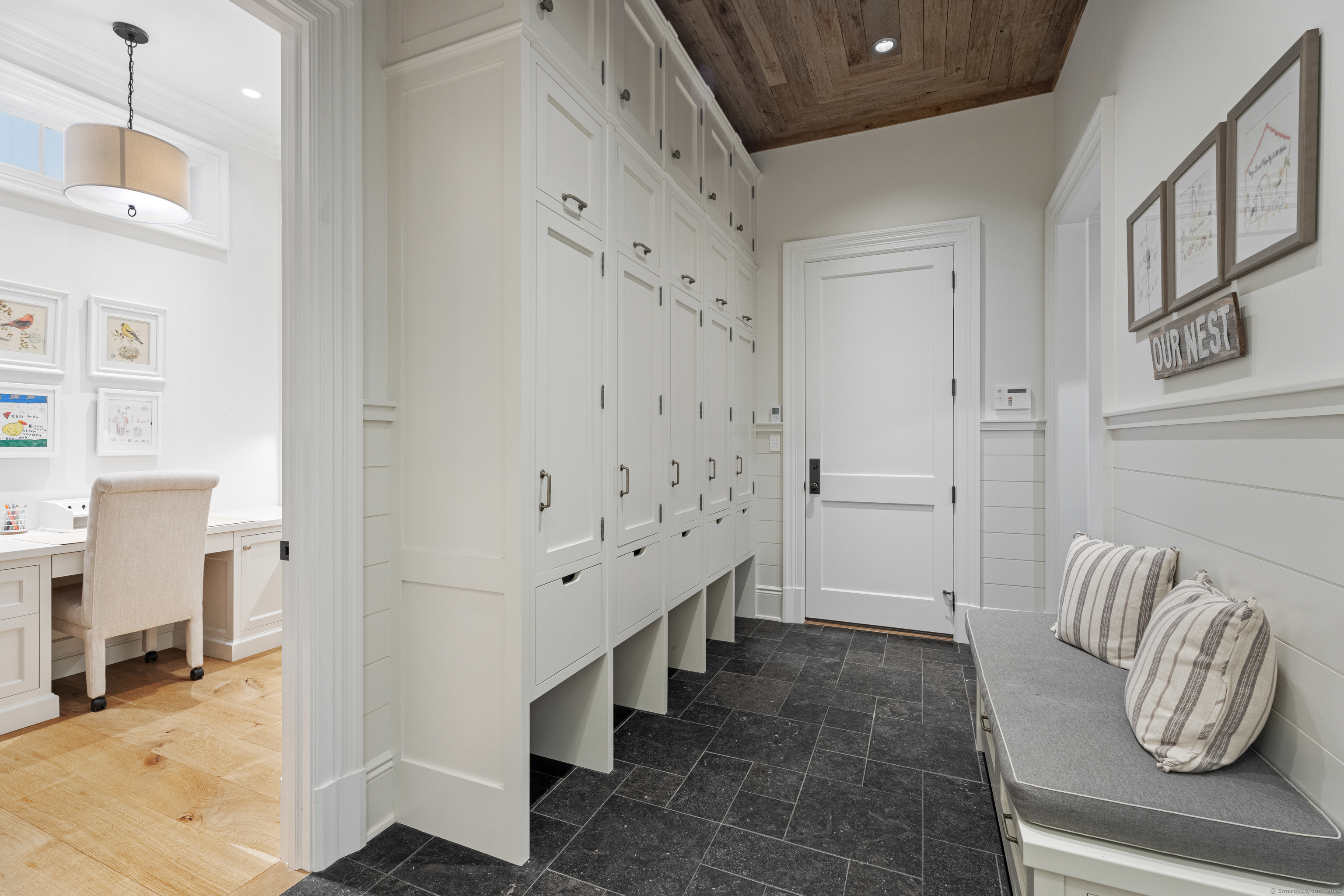 294 Maple Road Easton, CT 06612 - Photo 19 of 40 The dreamy mudroom offers both style and functionality, conveniently located near another private home office.