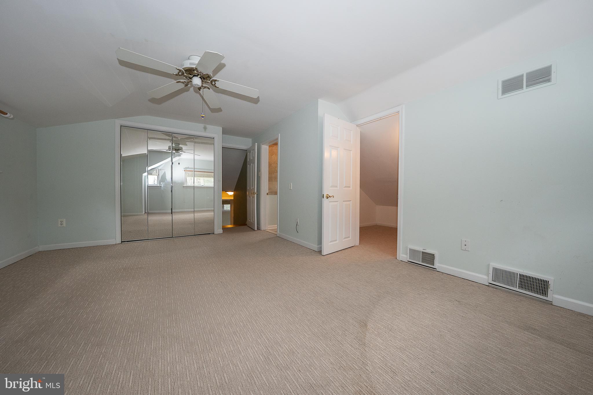 809 Matsons Ford Road Villanova, PA 19085 - Photo 12 of 24 an empty room with staircase and mirror