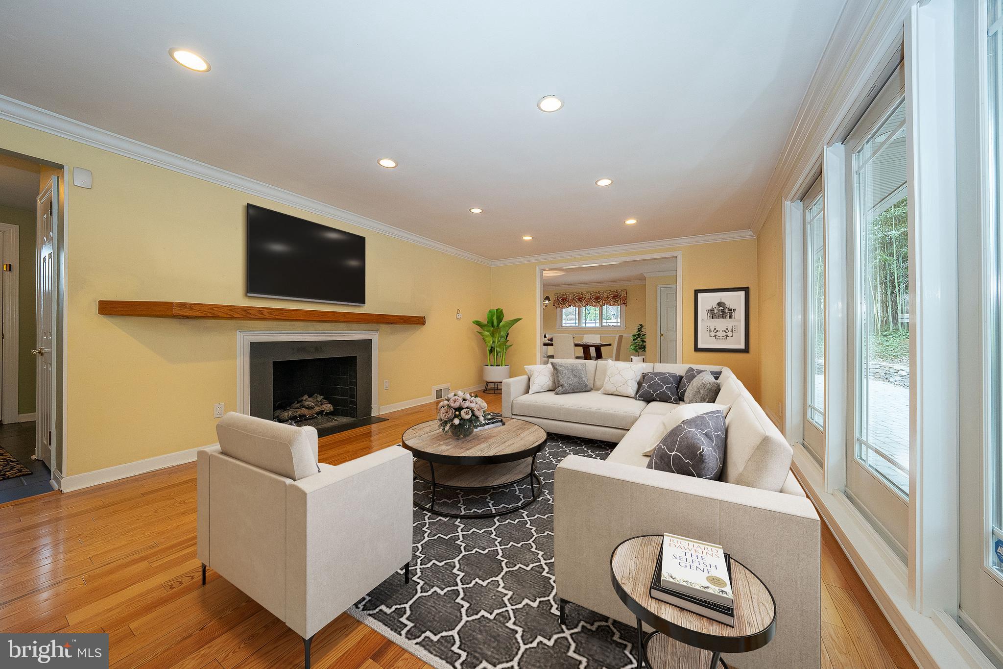 809 Matsons Ford Road Villanova, PA 19085 - Photo 2 of 24 a living room with furniture a fireplace and a large window