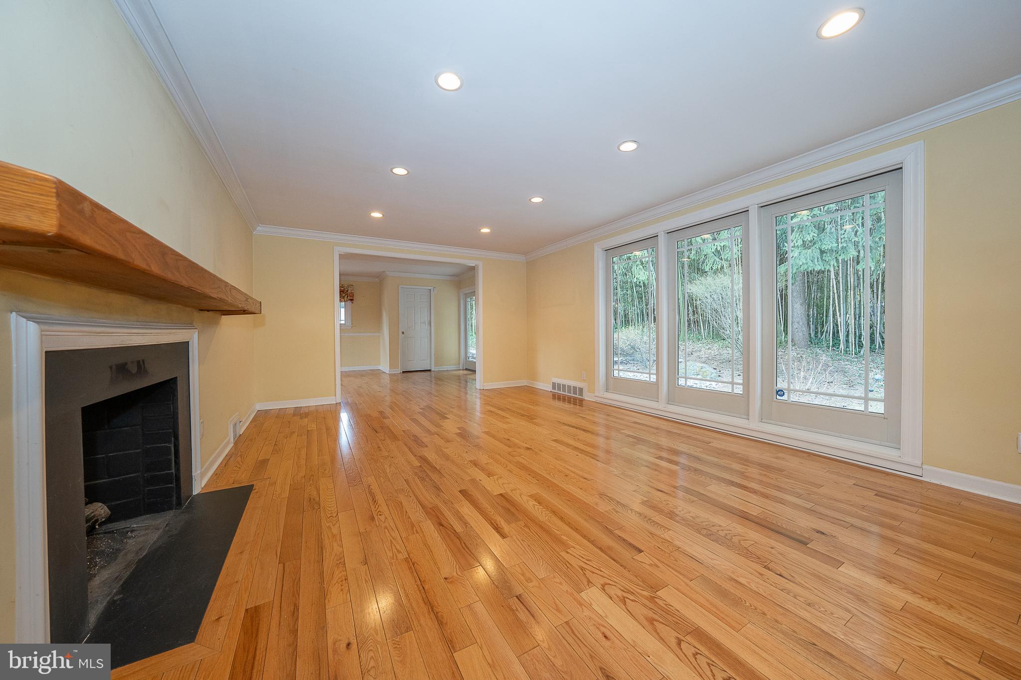 809 Matsons Ford Road Villanova, PA 19085 - Photo 3 of 24 a view of empty room with wooden floor and fireplace