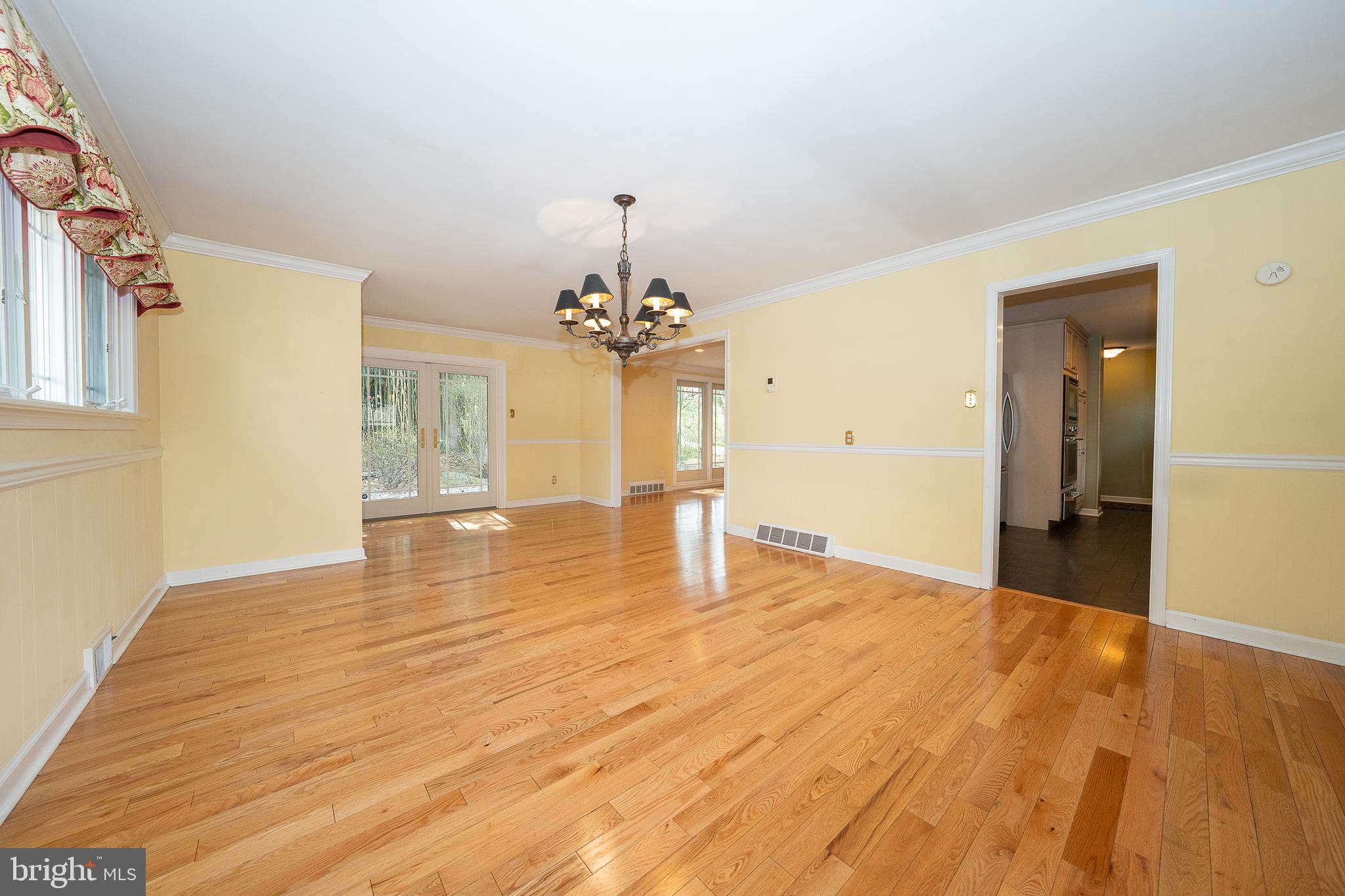 809 Matsons Ford Road Villanova, PA 19085 - Photo 5 of 24 a view of a livingroom with a chandelier fan and wooden floor