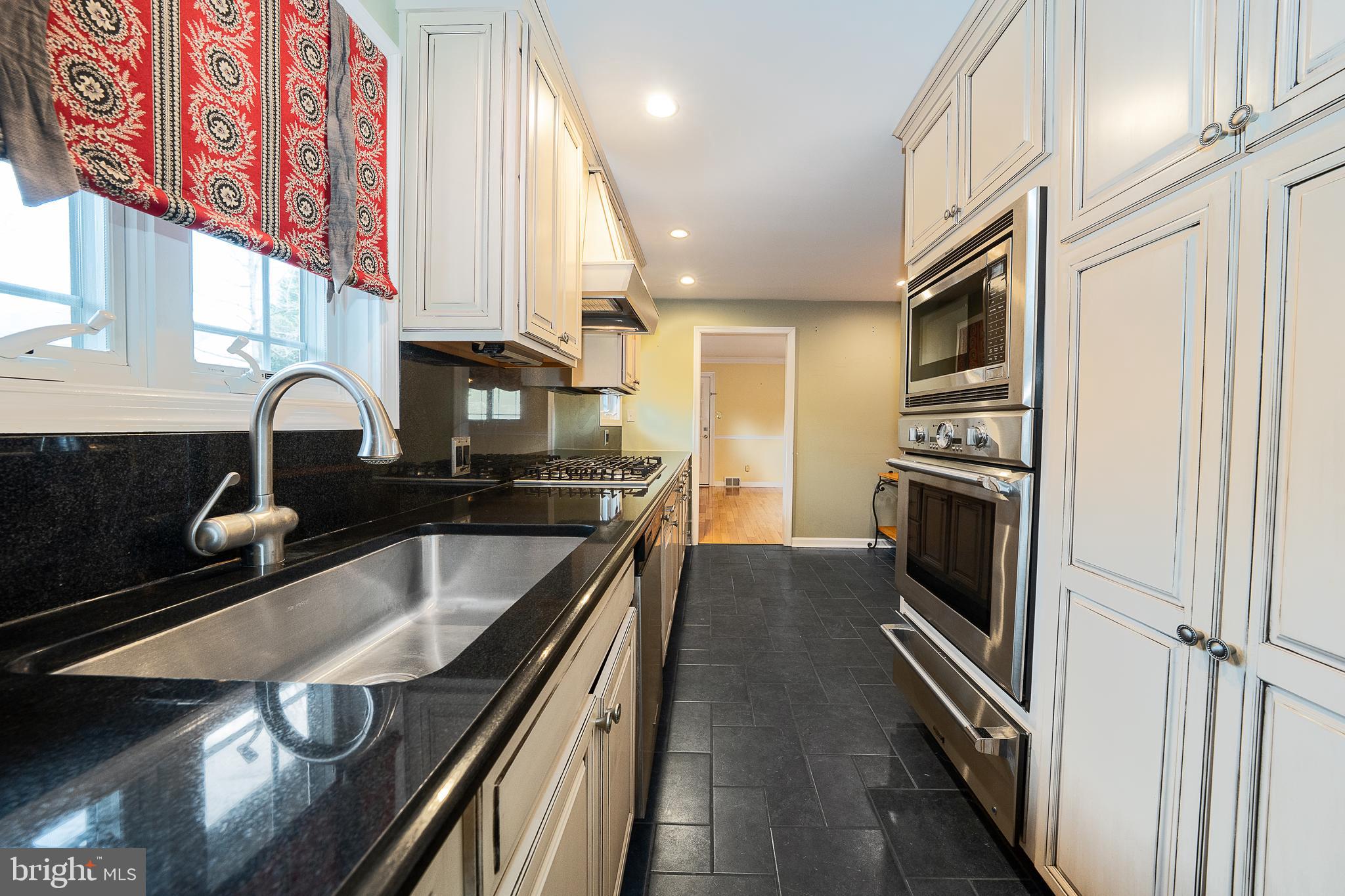 809 Matsons Ford Road Villanova, PA 19085 - Photo 6 of 24 a kitchen with stainless steel appliances granite countertop a sink a stove and a refrigerator