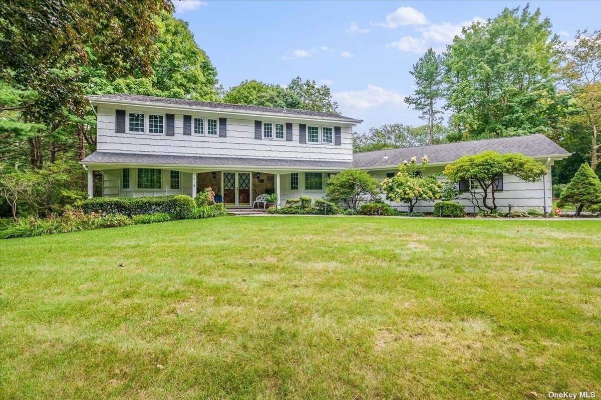 6 South Hollow Road Dix Hills, NY 11746 - Photo 1 of 1 a front view of a house with garden