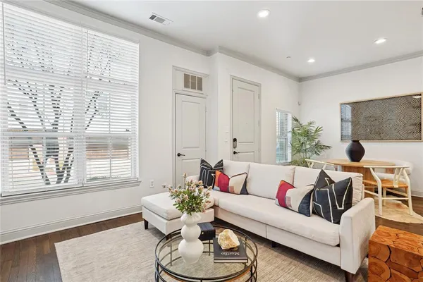 a living room with furniture and a large window
