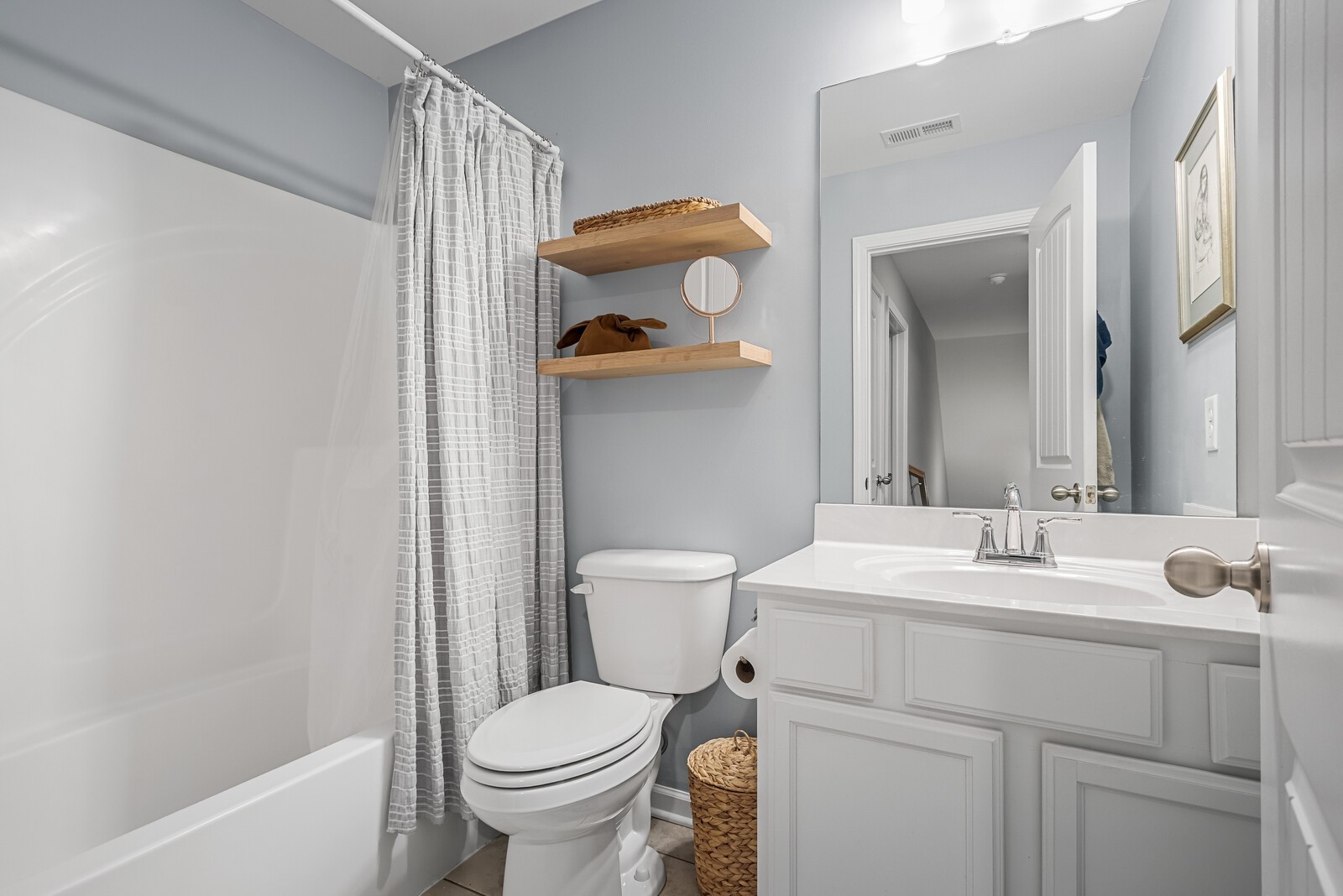 6004 Venable Court Fairview, TN 37062 - Photo 16 of 27 a bathroom with a sink toilet and vanity