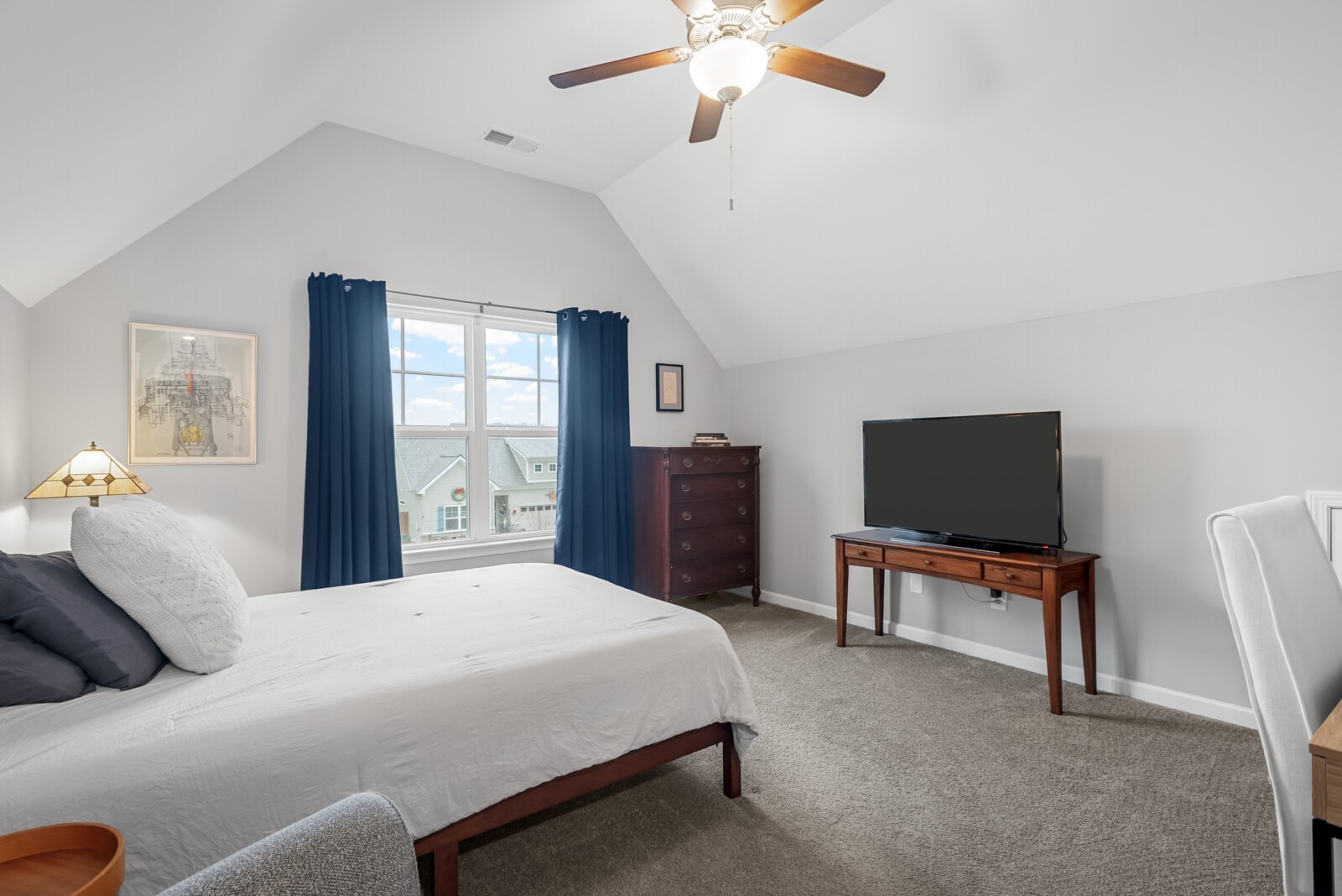 6004 Venable Court Fairview, TN 37062 - Photo 19 of 27 a bedroom with a bed and a flat screen tv