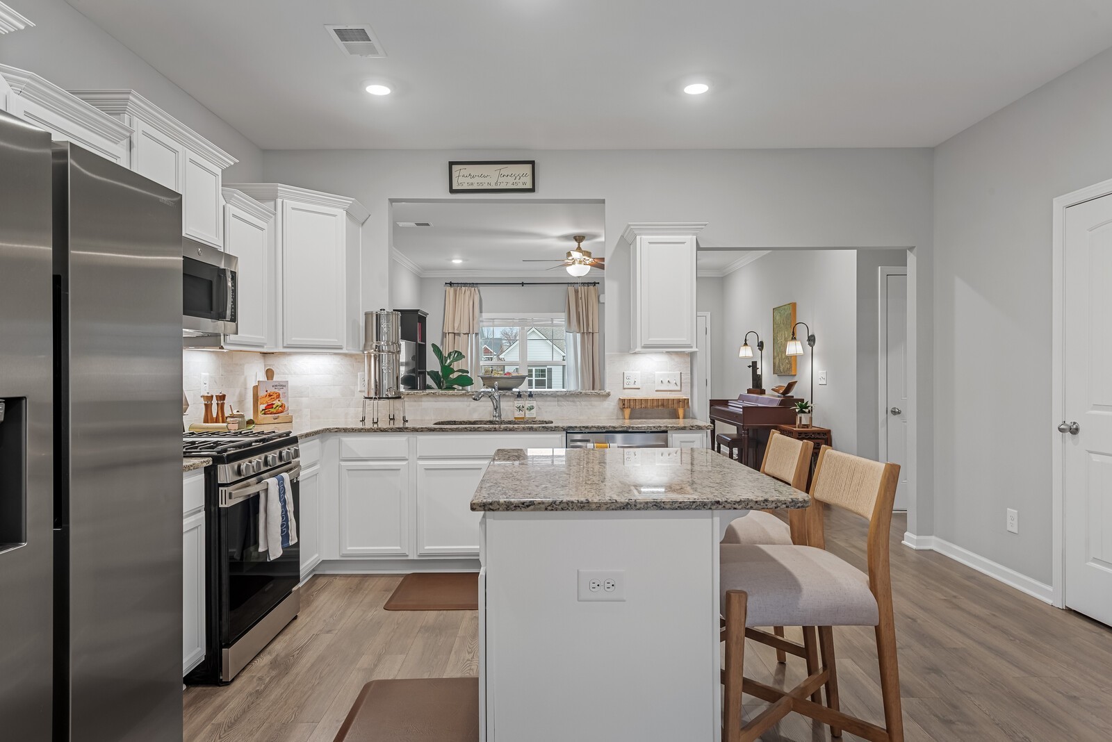 6004 Venable Court Fairview, TN 37062 - Photo 5 of 27 a kitchen with kitchen island granite countertop lots of counter top space and refrigerator