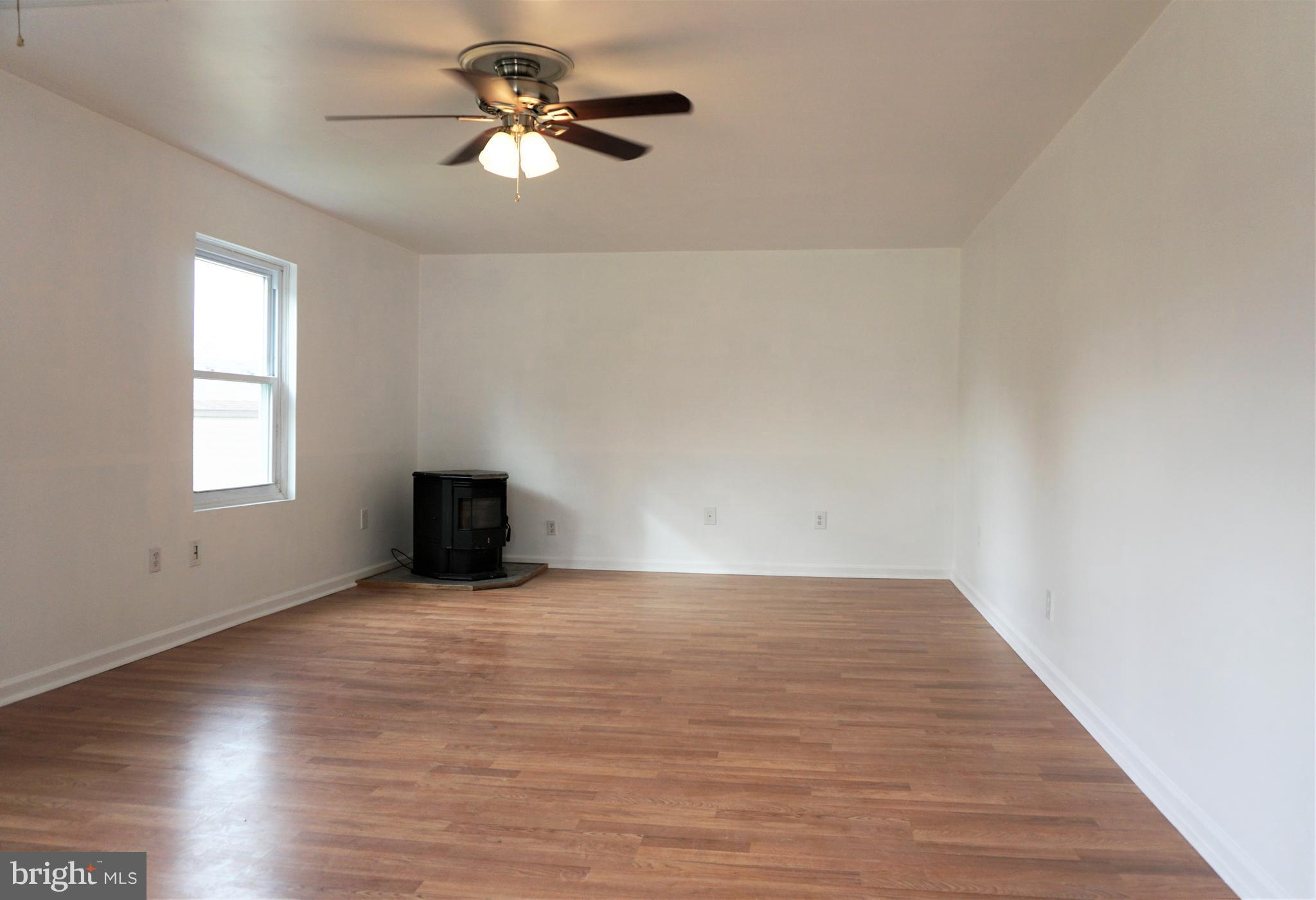 3328 Dublin Manor Road Street, MD 21154 - Photo 23 of 45 Family Room with Pellet Stove