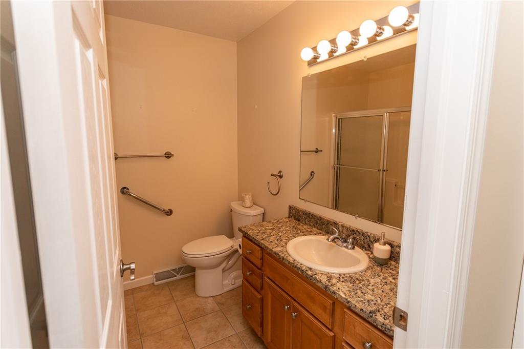 320 Dixon Boulevard Uniontown, PA 15401 - Photo 17 of 31 a bathroom with a granite countertop sink and a mirror
