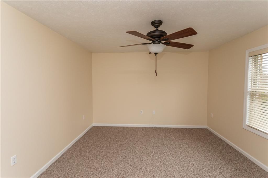 320 Dixon Boulevard Uniontown, PA 15401 - Photo 18 of 31 an empty room with a window and a fan