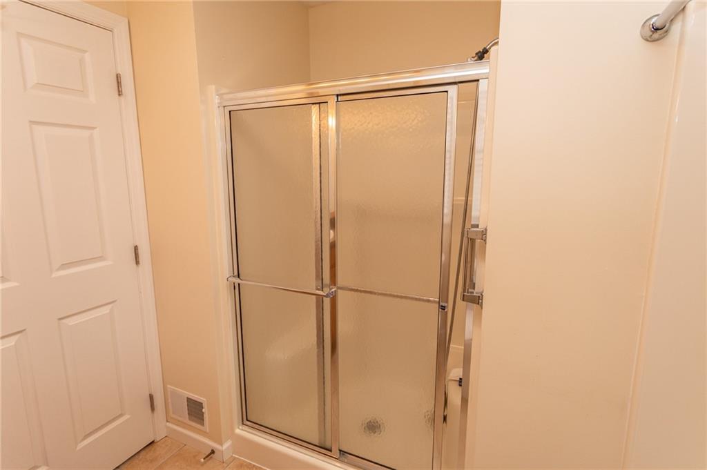 320 Dixon Boulevard Uniontown, PA 15401 - Photo 23 of 31 a bathroom with a glass shower door