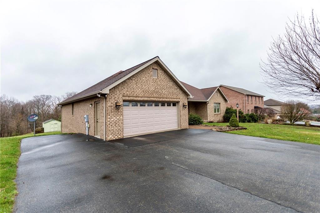 320 Dixon Boulevard Uniontown, PA 15401 - Photo 3 of 31 a view of a house with a yard and garage