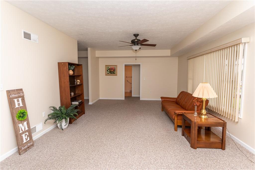320 Dixon Boulevard Uniontown, PA 15401 - Photo 10 of 31 a living room with furniture and a chandelier