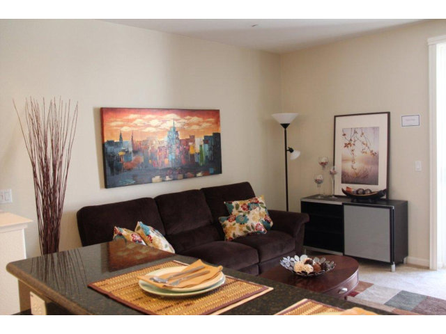 1812 Snell Place Milpitas, CA 95035 - Photo 2 of 19 a living room with furniture a rug and a flat screen tv