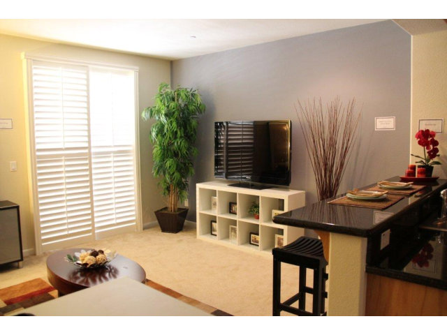 1812 Snell Place Milpitas, CA 95035 - Photo 3 of 19 a living room with furniture and a flat screen tv