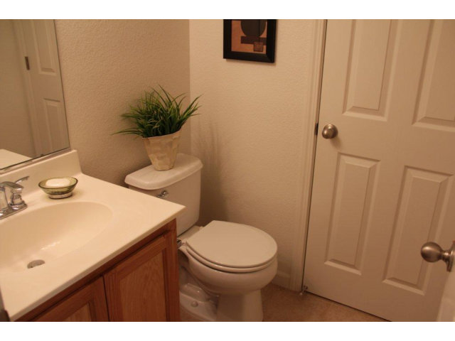 1812 Snell Place Milpitas, CA 95035 - Photo 5 of 19 a bathroom with a sink a toilet and mirror