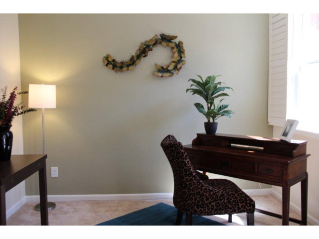 1812 Snell Place Milpitas, CA 95035 - Photo 6 of 19 a dining room with a table and potted plants
