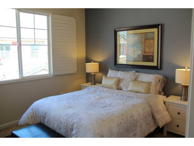 1812 Snell Place Milpitas, CA 95035 - Photo 7 of 19 a bedroom with a bed and a window