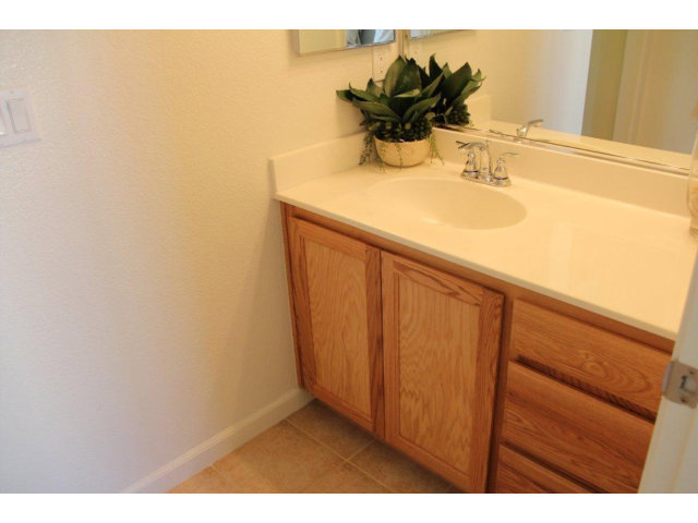 1812 Snell Place Milpitas, CA 95035 - Photo 8 of 19 a bathroom with a sink and a mirror