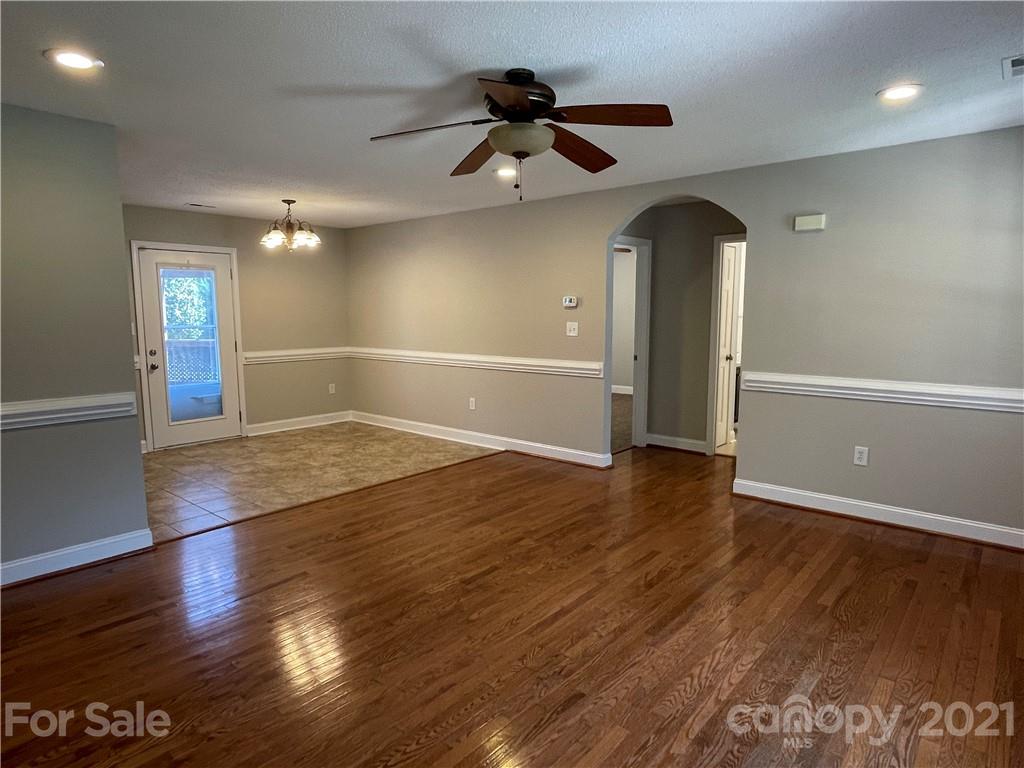 3622 Lee Moore Road Maiden, NC 28650 - Photo 2 of 34 a view of empty room with wooden floor and fan