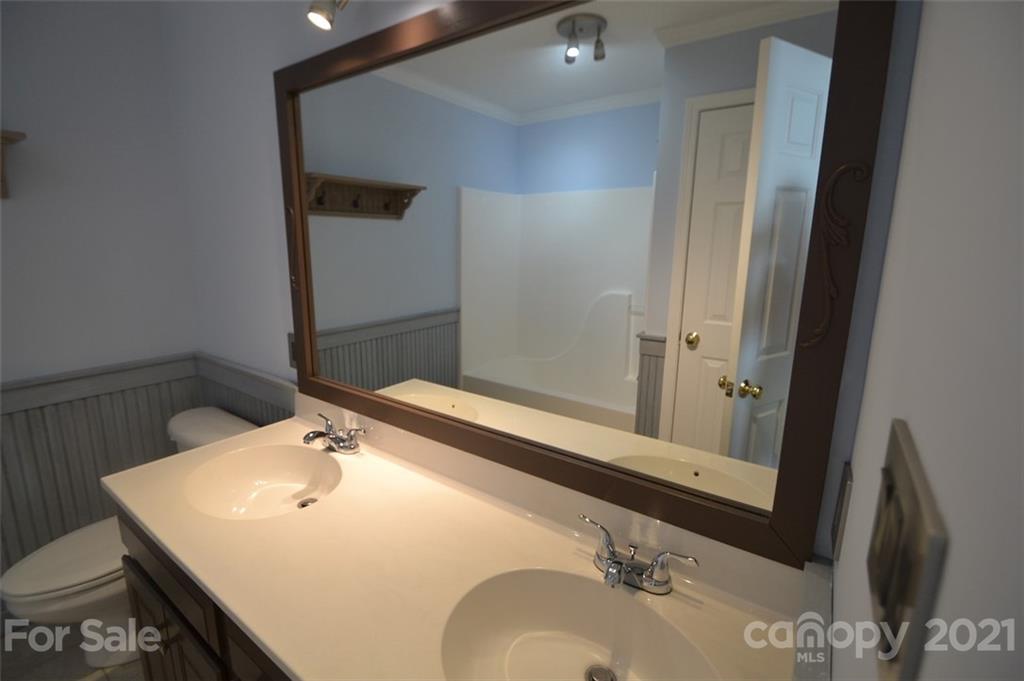 3622 Lee Moore Road Maiden, NC 28650 - Photo 11 of 34 a bathroom with a sink and a mirror