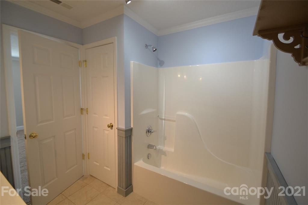 3622 Lee Moore Road Maiden, NC 28650 - Photo 13 of 34 a bathroom with a shower and a bath tub