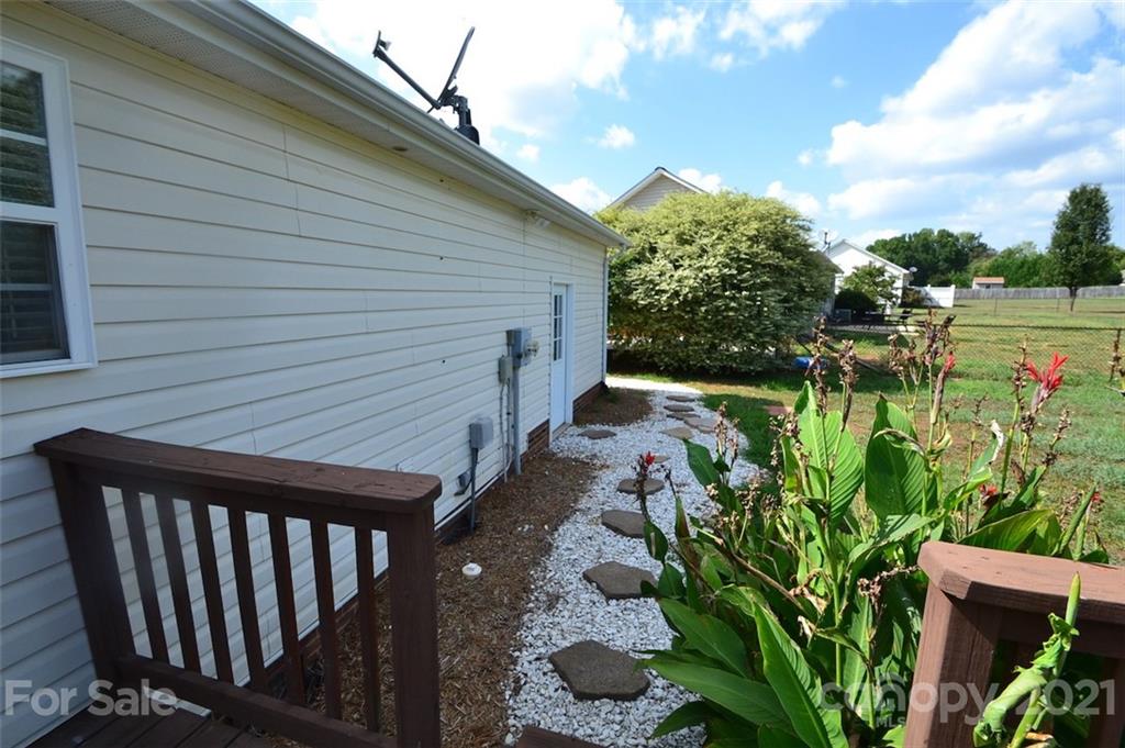 3622 Lee Moore Road Maiden, NC 28650 - Photo 22 of 34 a backyard of a house with lots of green space