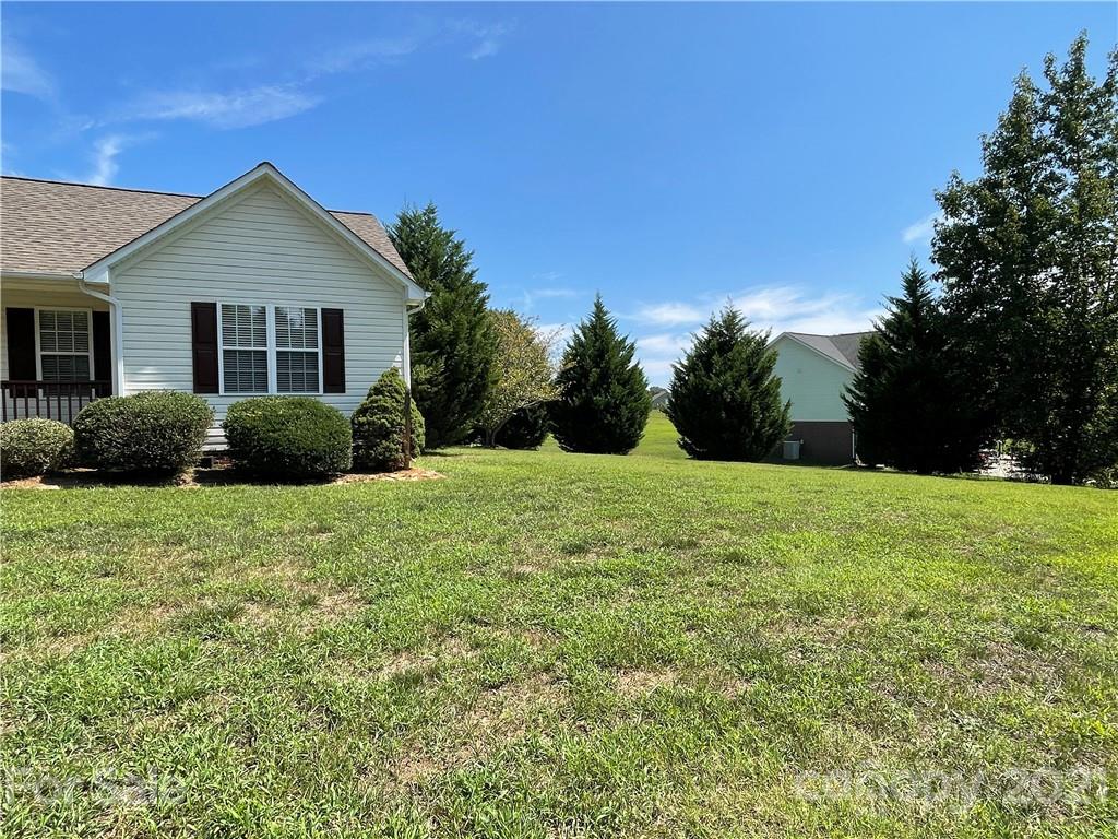 3622 Lee Moore Road Maiden, NC 28650 - Photo 25 of 34 a front view of a house with yard and green space