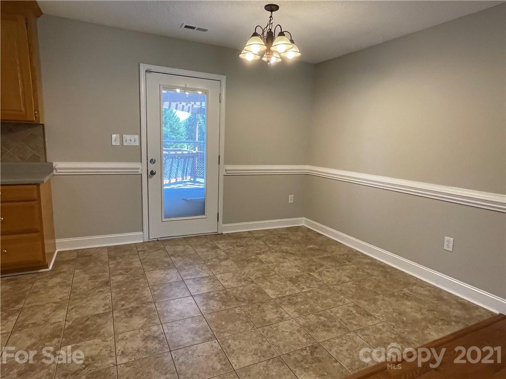 3622 Lee Moore Road Maiden, NC 28650 - Photo 4 of 34 a view of an empty room with chandelier
