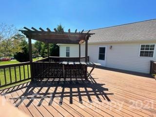 3622 Lee Moore Road Maiden, NC 28650 - Photo 33 of 34 a view of a patio with table and chairs with wooden floor and fence